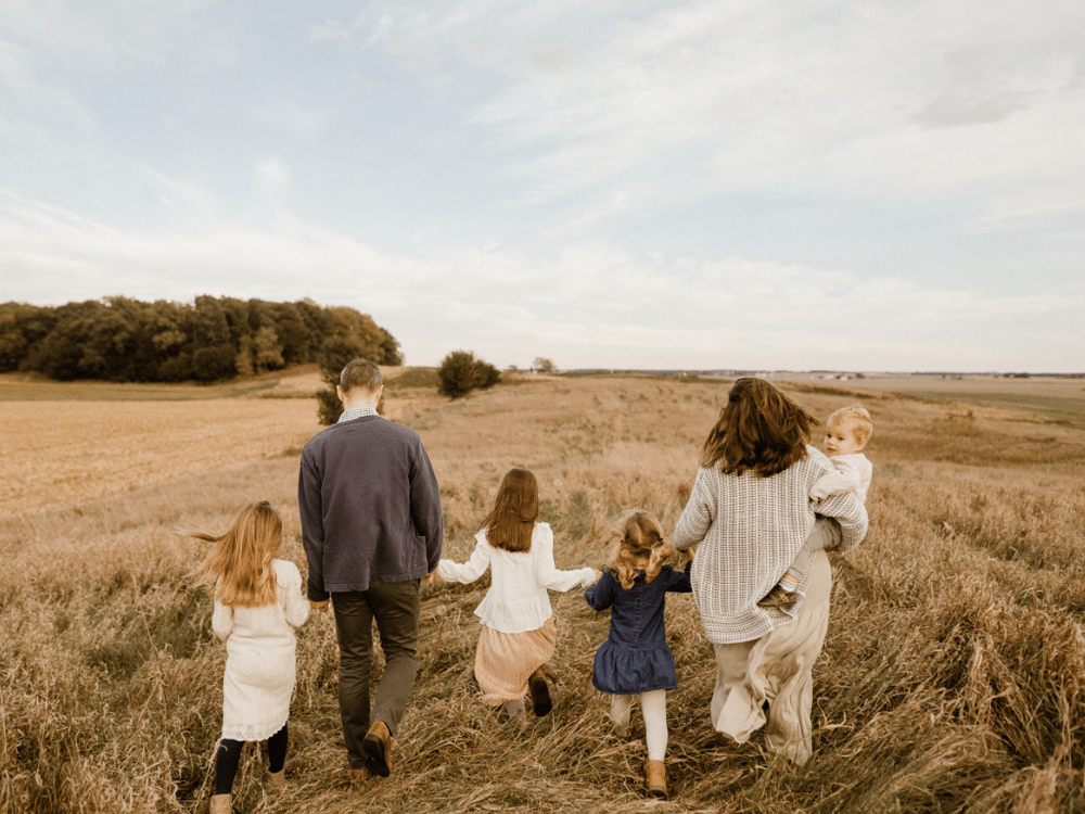 A family walking through a field